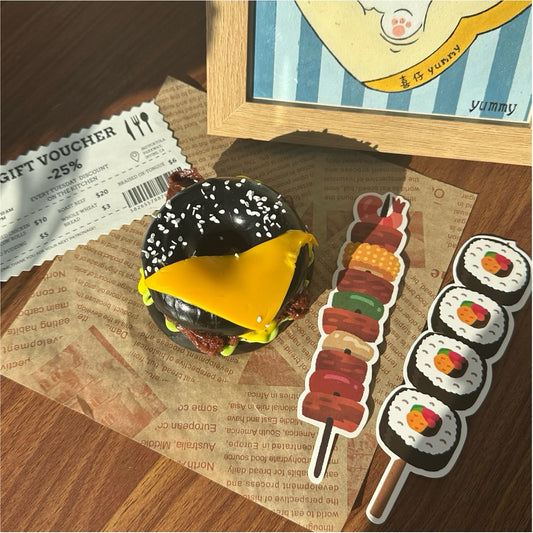 Cheesy Black Bagel Taba Squishy Toy